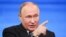 Russian President Vladimir Putin speaks at a televised question-and-answer session on December 14.