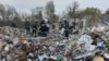 Rescuers work at the site of a suspected Russian missile strike on the village of Hroza last week, which killed 59 people. 