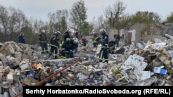 Rescuers work at the site of a suspected Russian missile strike on the village of Hroza last week, which killed 59 people. 