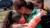 UKRAINE -- Khrystyna Pyimak, 11, hugs her mother Oksana Velychko, 42, after evacuation from Vovchansk, Ukraine, Sunday, May 12, 2024. 