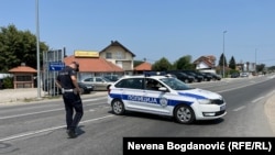 Police close the road to Lipnicki Sor in Loznica on July 18.