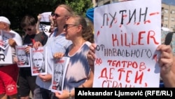 Protesters join a demonstration under the moniker "Putin is a Killer" organized by supporters of imprisoned Russian opposition leader Alexei Navalny, in Podgorica, Montenegro, on August 20.