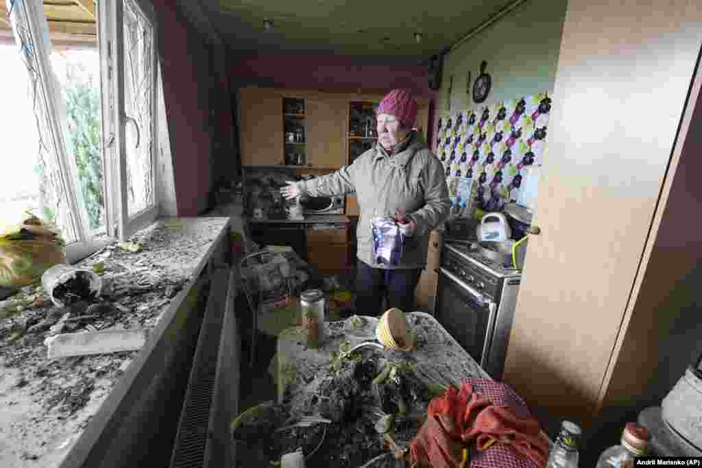 Tetiana Legorova, 55, &nbsp;shows the kitchen of her house that was damaged by a Russian rocket attack in Kharkiv, Ukraine, on March 31.