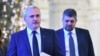 Marcel Ciolacu (dreapta) a fost propus premier pe 13 iunie 2023. Cariera sa politică a luat amploare sub conducerea lui Liviu Dragnea (stânga), de care s-a dezis însă când a simțit decăderea fostului lider PSD.