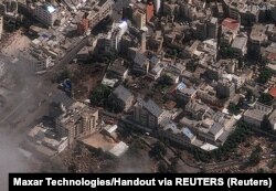 O imagine din satelit arată spitalul Al-Ahli din Gaza după ce sute de palestinieni au fost uciși într-o explozie pentru care oficialii israelieni și palestinieni și-au atribuit reciproc vina, 18 octombrie 2023.