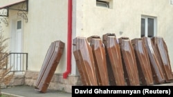 Nagorno-Karabakh - Coffins are placed outside a morgue in Stepanakert amid fierce fighting with Azerbaijani forces, September 24, 2023.