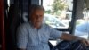 Pensionisti Shefqet Hasa punon si shofer i linjës urbane Tiranë-Kamëz. 