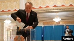 Former Kazakh President Nursultan Nazarbaev votes in Astana during his country's parliamentary elections, which were held on March 19.