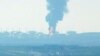 UKRAINE – A fire at an oil depot near the Crimean bridge in the village of Volna in the Krasnodar region of Russia is visible from the territory of the occupied Crimea across the Kerch Strait, May 3, 2023