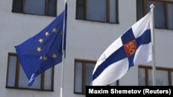 Flags of the European Union and Finland fly outside the Finnish Embassy in Moscow. (file photo)
