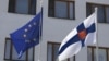 The flags of the European Union and Finland fly outside the Finnish Embassy in Moscow. (file photo)