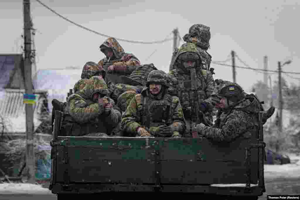 Ukrainian soldiers ride aboard a truck in the Donetsk region. &quot;The volumes that we have today are not sufficient for us today, given our needs. So, we&#39;re redistributing it. We&#39;re replanning tasks that we had set for ourselves and making them smaller because we need to provide for them,&quot; General Tarnavskiy said, without providing details. &nbsp;
