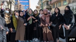 Afghan women stage a protest for their rights to mark International Women's Day in Kabul on March 8, 2023.