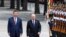 Chinese President Xi Jinpin (left) and Russian President Vladimir Putin review an honor guard during an official welcome ceremony in Beijing on May 16.