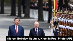 Си Цзиньпин и Путин во время его майского визита в Китай