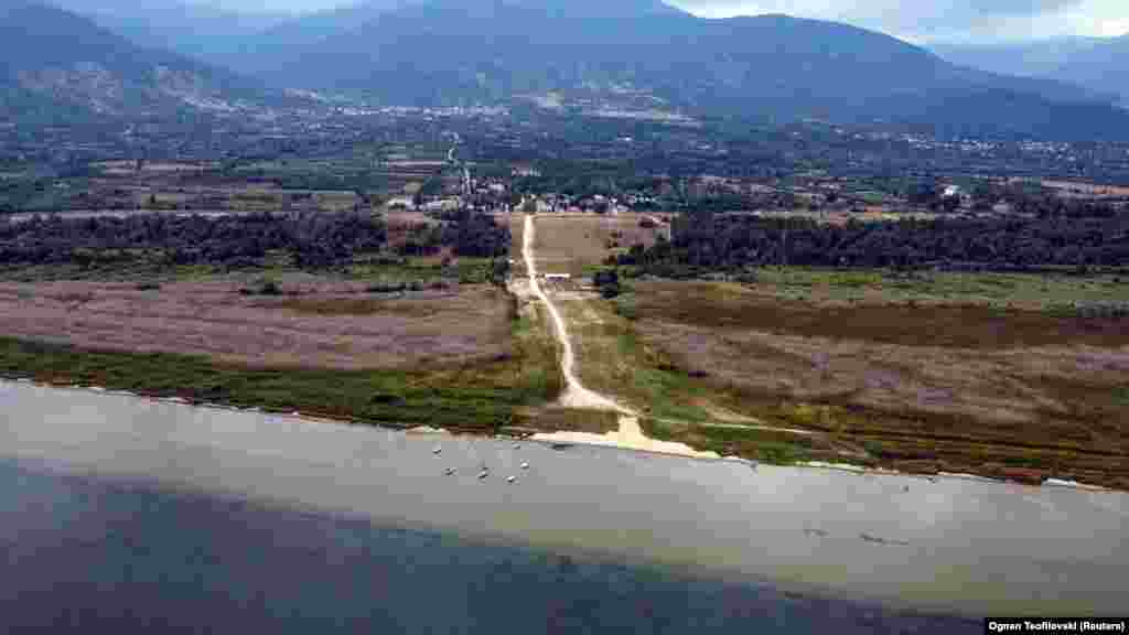 A drone photo shows the location of the former waterline, which is more than 1 kilometer away from the current waterline in Pretor on September 6. NASA said that satellite images from 2022 show that the lake had lost 7 percent of its surface area and half of its volume between 1984 and 2020.&nbsp;