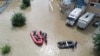 Rescuers use inflatable boats to evacuate residents from a flooded area in the city of Usuriisk on August 12. 