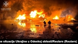 Four civilians were reported injured in the Black Sea port city of Odesa as a result of an overnight missile attack that struck residential buildings and a granary.