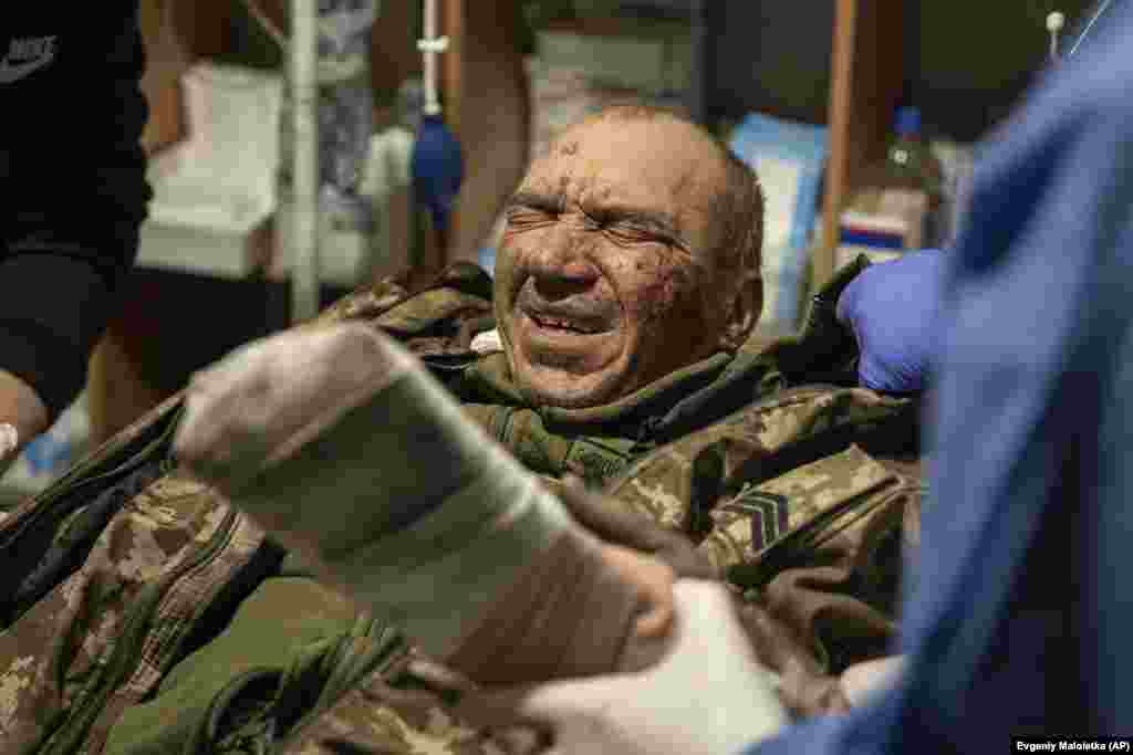 A wounded Ukrainian soldier known as Alpha is treated for his battle wounds.