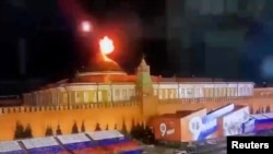 Video footage shows a flying object exploding in an intense burst of light near the dome of the Kremlin Senate building during the alleged Ukrainian drone attack in Moscow on April 29.