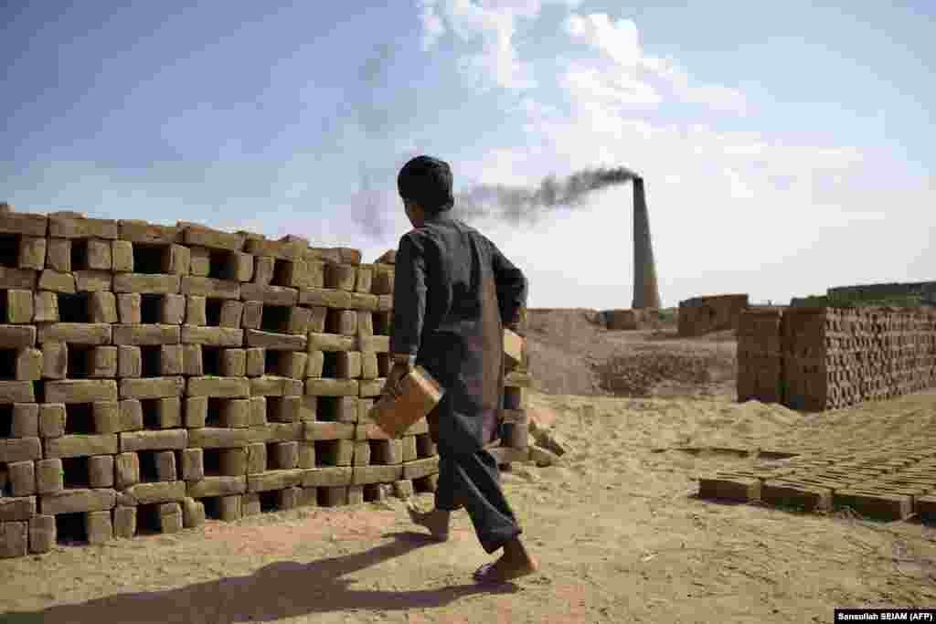 An Afghan boy works at a brick kiln in the Dand district of Kandahar Province.
