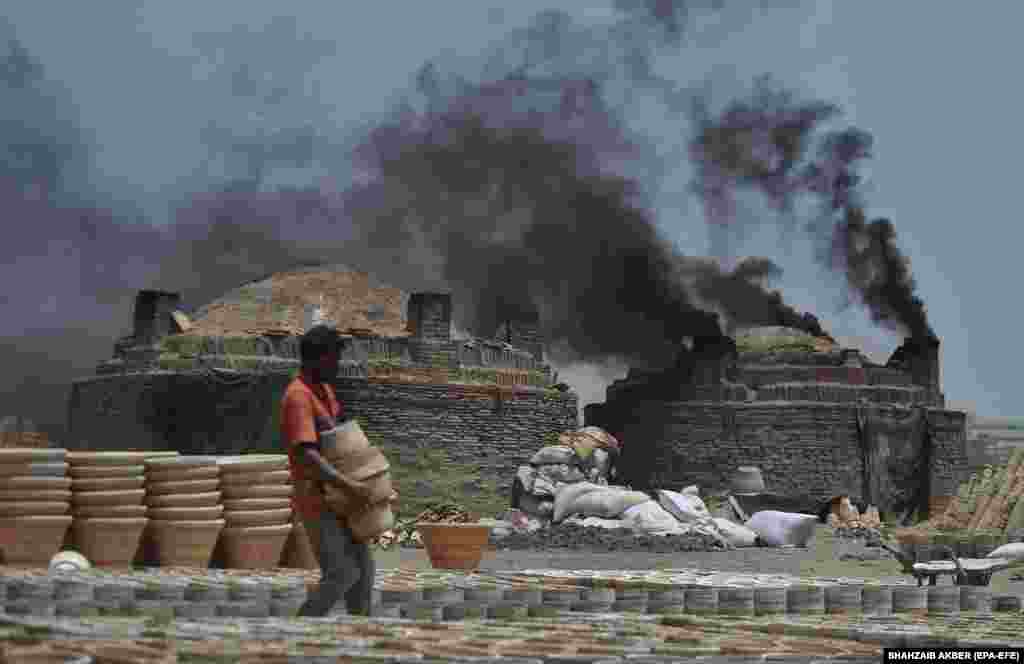 Smoke billows from a pottery kiln in Karachi, Pakistan.&nbsp;