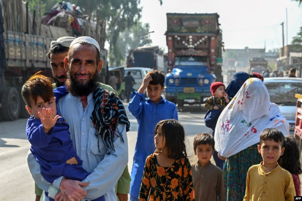 An Afghan refugee family arrives at a repatriation center. With millions of Afghans already living with food insecurity, the country&#39;s already dire humanitarian situation may worsen with the arrival of impoverished Afghans from Pakistan. &nbsp;