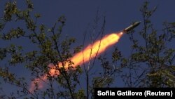 Ukrainian soldiers fire a RAK-SA-12 multiple-launch rocket system toward Russian troops near the frontline town of Bakhmut on July 10.