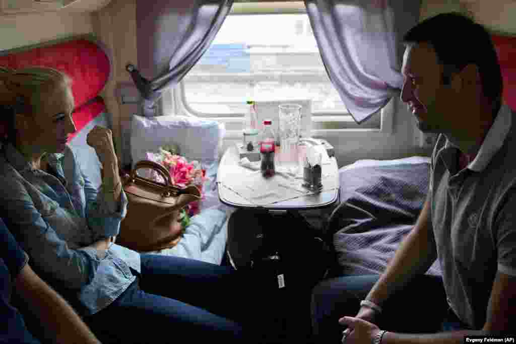 The couple travels from Kirov to Moscow on a train on July 20, 2013, when he was released after receiving a suspended sentence on the embezzlement charge. &nbsp;
