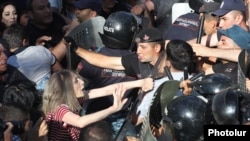 Armenia - Protesters and riot police clash outside the Armenian parliament, Yerevan, June 12, 2024.