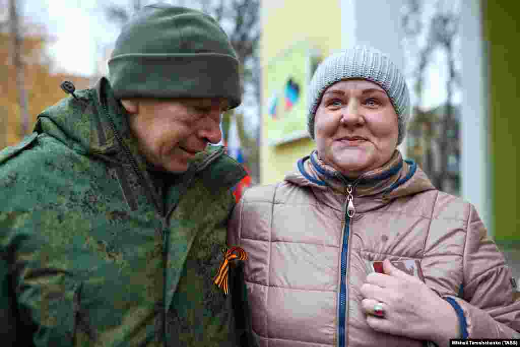 A pro-Russia fighter reunites with a family member in Ukraine&rsquo;s Donetsk region after a prisoner swap on November 6, 2022. &nbsp;