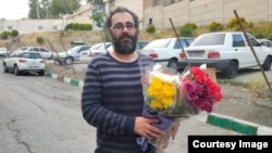 Mohammad Habibi, a teacher and union activist pictured upon his release from Tehran's Evin Prison in 2023, said police seized his mobile phones and a laptop when they arrested him and the belongings have still not been returned.
