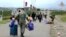 Nagorno-Karabakh - Russian peacekeepers help ethnic Armenian civilians to take shelter at their base near Stepanakert, September 21, 2023