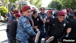 Armenia - Police detain a protester in Yerevan, May 27, 2024.