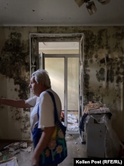 Mykola Andryushchenko surveys his ravaged apartment.