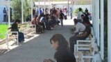 A long line of Turkmen wait outside the offices of the country's Migration Service in the eastern city of Turkmenabat in Lebap Province. (file photo)