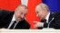 Russian President Vladimir Putin (right) speaks with Azerbaijani President Ilham Aliyev. (file photo)