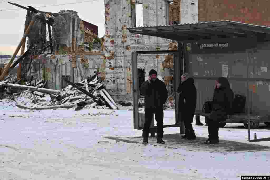 At a bus stop opposite the golden-domed Orthodox church, 62-year-old Halyna waited with two large shopping bags. &quot;I lived here under the Russian occupation,&quot; she said nervously, declining to give her surname. &quot;But I&#39;m afraid of another attack. I&#39;m going to Kharkiv. My daughter is there. I want to stay there to be safe.&quot;