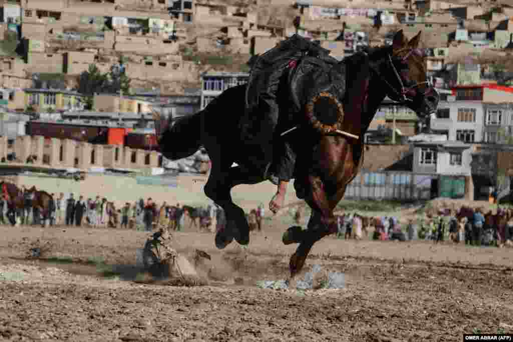 Afghan horsemen compete in the traditional sport of buzkashi in the Fayzabad district of Badakhshan Province.