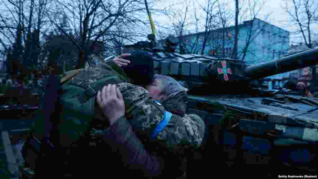 A woman hugs a Ukrainian soldier in the town of Bakhmach in the Chernihiv region that had just been retaken by Ukrainian troops, on April 2, 2022.