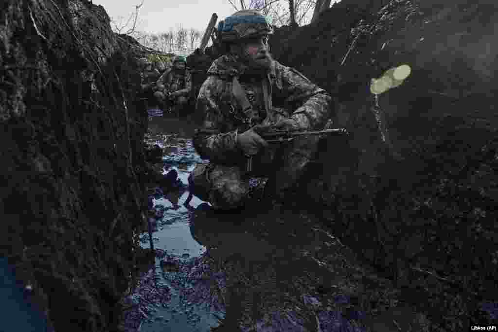 Ukrainian soldiers tasked with defending the city have been living in waterlogged and muddy trenches.