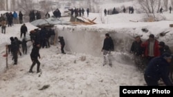 An avalanche destroyed several buildings in Khorugh, killing eight people.