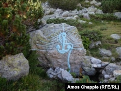 A painting on a rock at a spring that is a primary water source for the White Brotherhood camp.