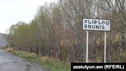 Armenia - A road sign at the entrance to the village of Bnunis, April 10, 2023.