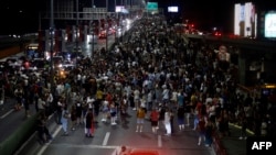 Demonstrators block a highway in Belgrade on August 10 to protest against the government's plan to reboot a lithium mining project.