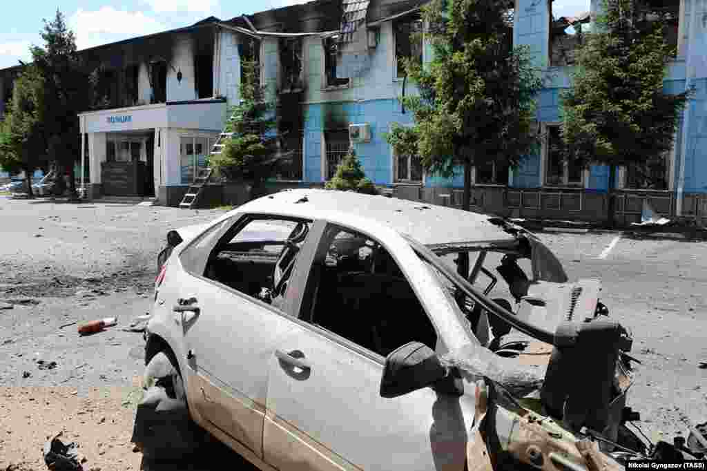 A June 6 photo shows a destroyed police station and car in Shebekino, the administrative capital of Belgorod&rsquo;s Shebekino district. Natalya Cheremchenko,&nbsp;an evacuated resident of the district,&nbsp;told Current Time on June 5, &quot;the dry facts [about the situation in the region] that our government, our Ministry of Defense transmits, do not convey the reality of what is happening there.&quot;