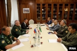 Russian military officials meet with an Iranian military delegation in Moscow in August.