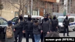 Police in the Azerbaijani capital, Baku, during a raid of the Toplum TV offices on March 6.