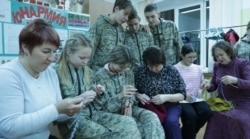 Students from School No. 8 in the city of Mozhga and their mothers and grandmothers knit stockings for soldiers with amputated limbs.