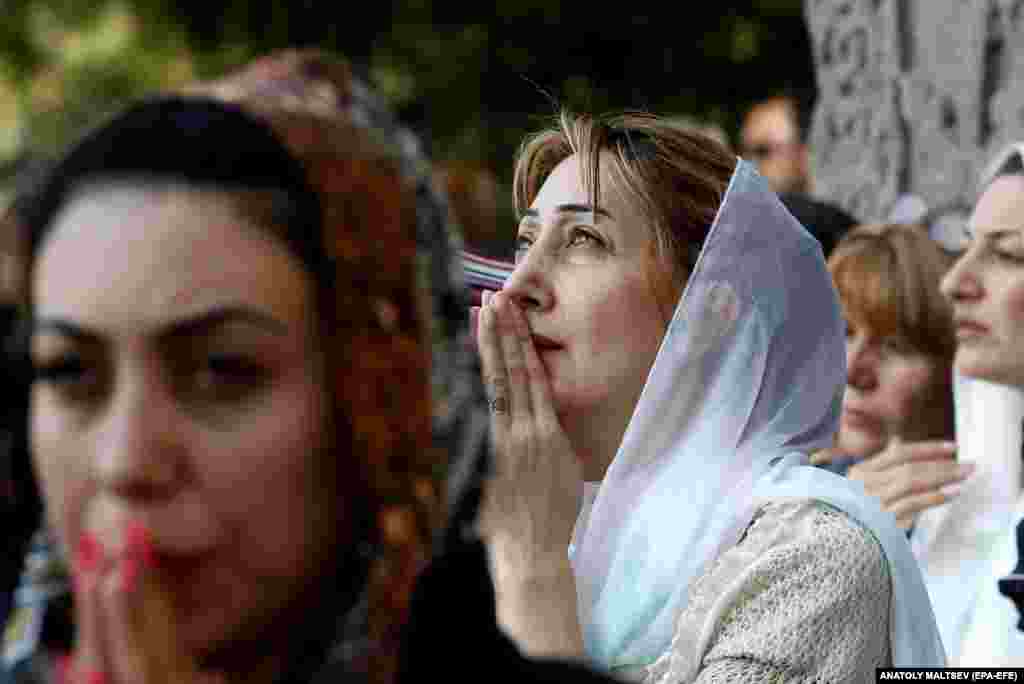 Armenians pray in the city of Vagharshapat, Armenia, on October 1. Armenia observed a national day of prayer with Armenians around the world marking the event with peaceful protests of the upcoming dissolution of Nagorno-Karabakh, which Armenians refer to as Artsakh.